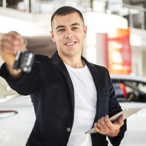 happy-young-man-holding-car-keys